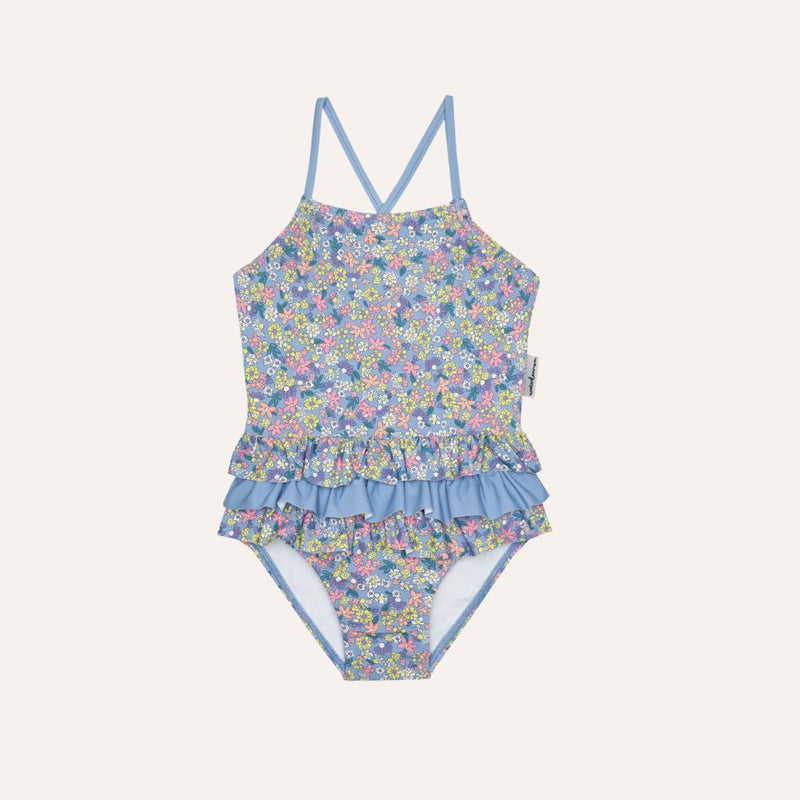 Traje de baño volantes flores fondo azul