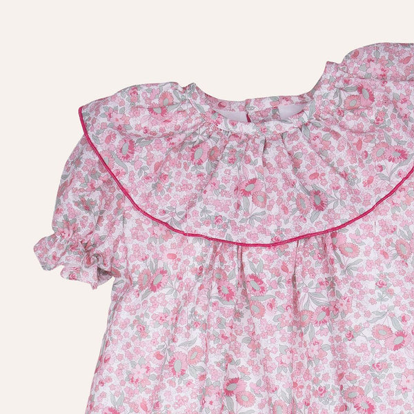 Vestido tablitas volantón flor rosa