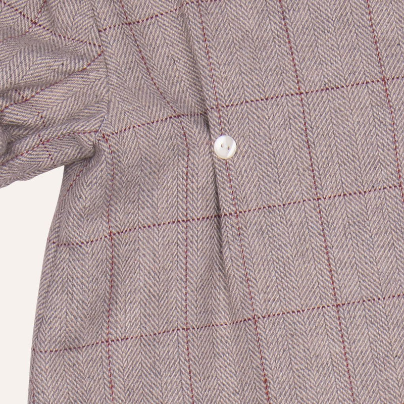 Jesusito cruzado beige con volante